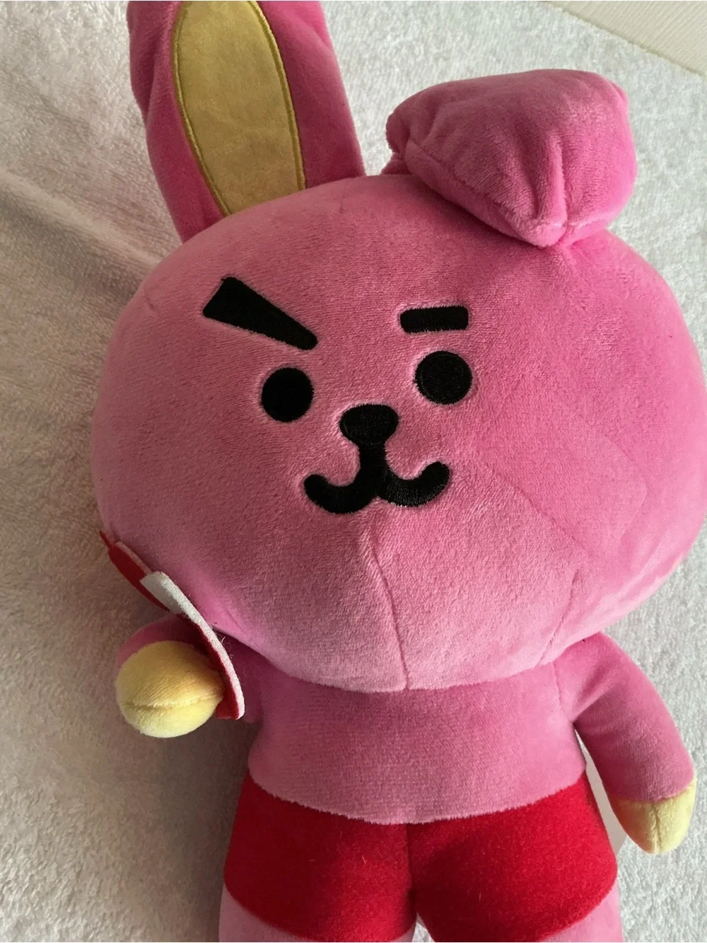Bright Pink Plush Bunny Character Toy with Red Shorts